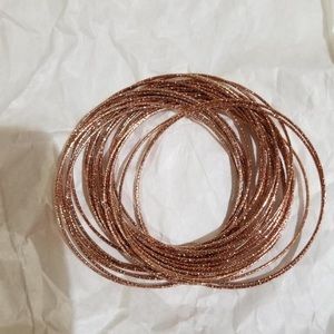 Rose gold sterling silver bangles.